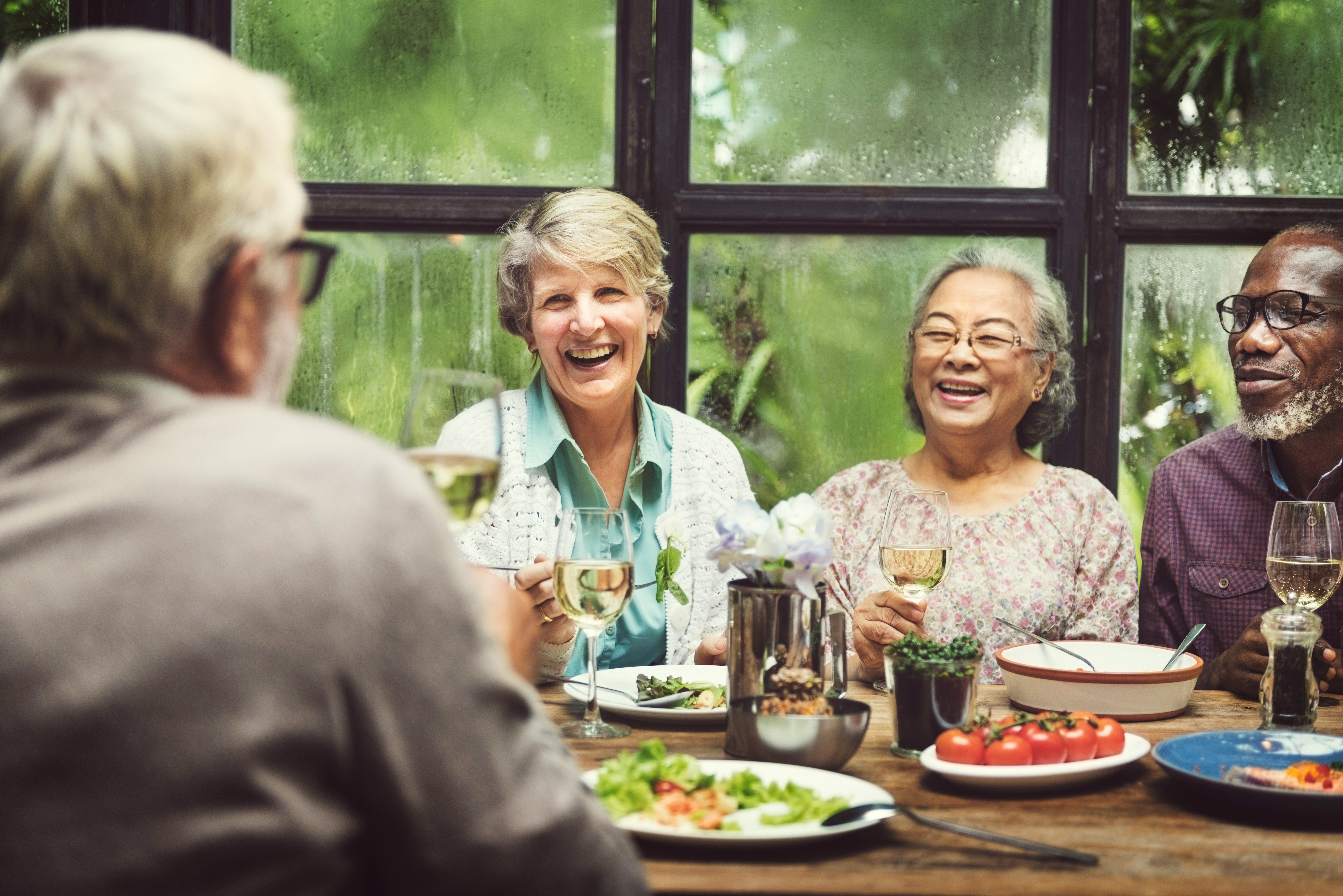 A group of people enjoying dinner together